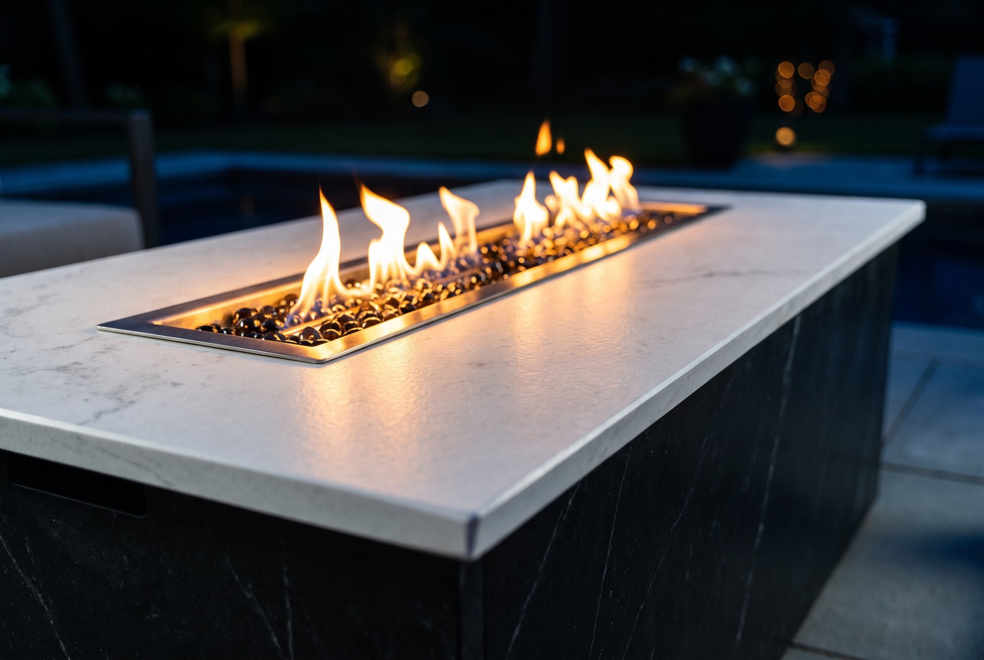 Stainless burner and fire glass in a Dekton fire table