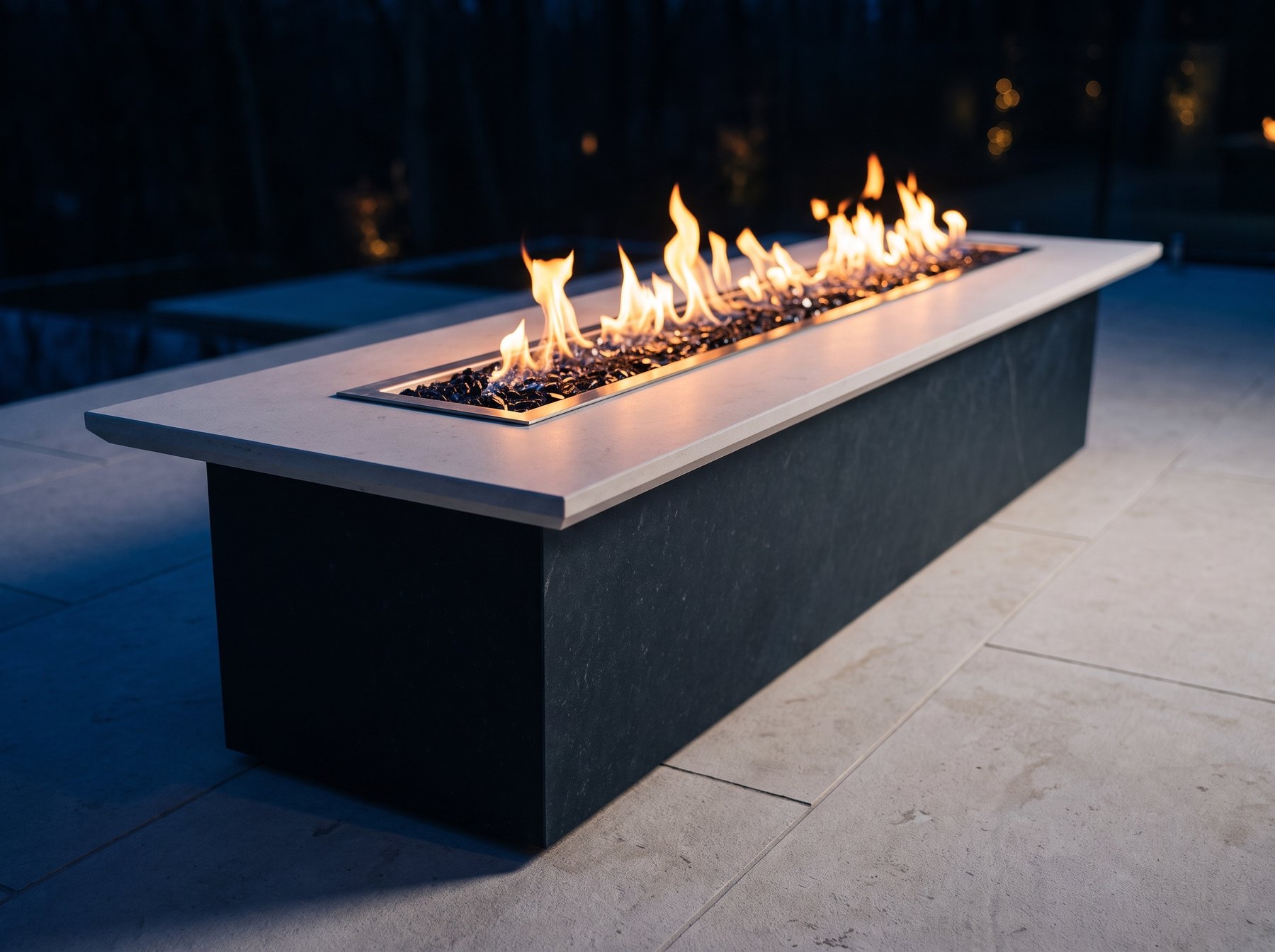 El Camino fire table lit at night